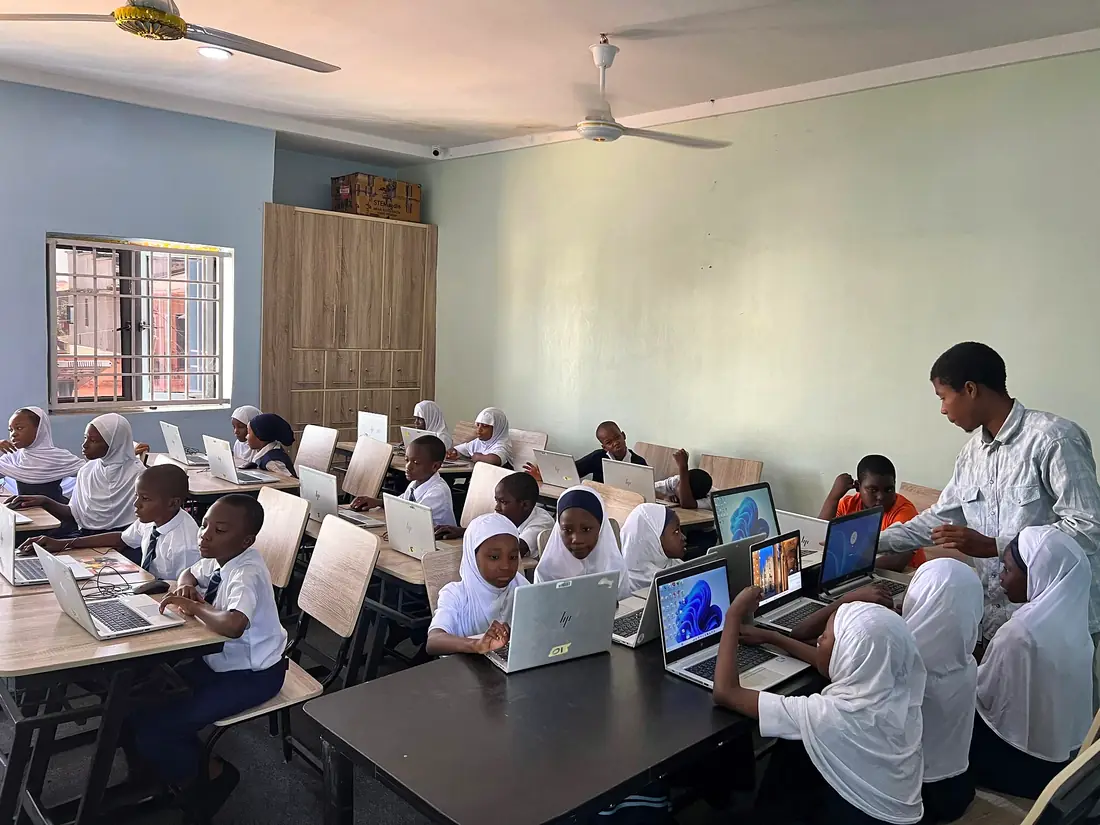 A full ICT class working on laptops
